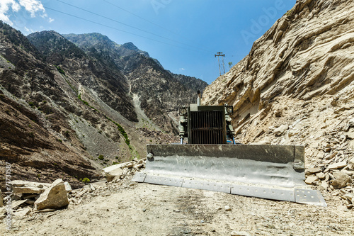 Bulldozer doing road construction in Himalayas photo