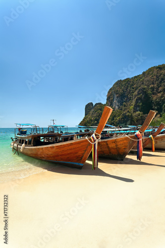 wooden boat and sandy beach. © sergeytimofeev