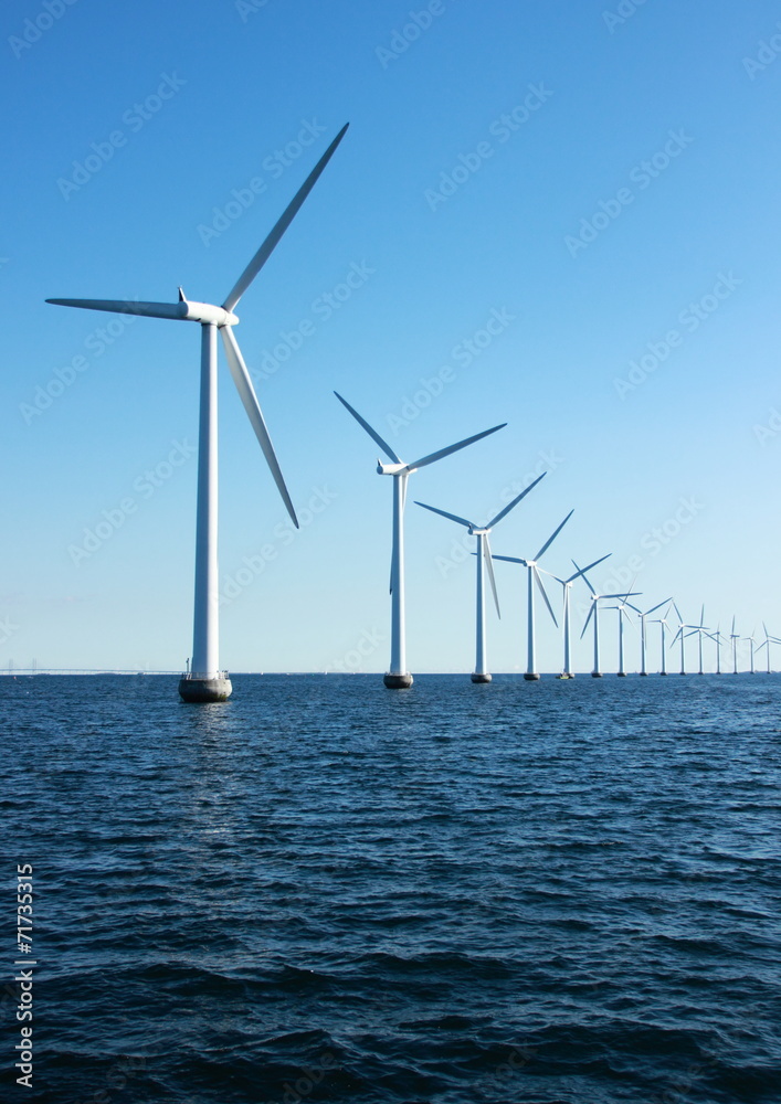 Vertical perspective of ocean windmills with horizon