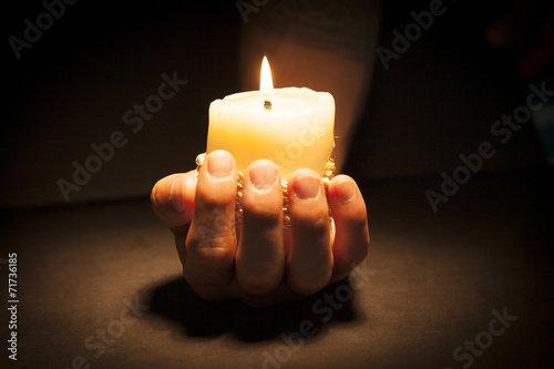 Hands with candle