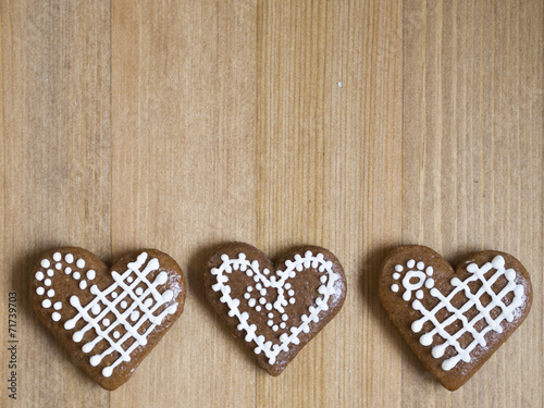 Three gingerbread hearts in a row