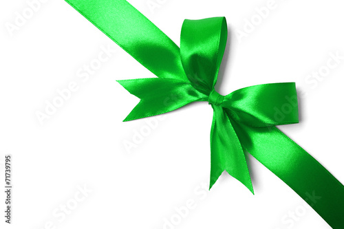 Shiny green satin ribbon on white background