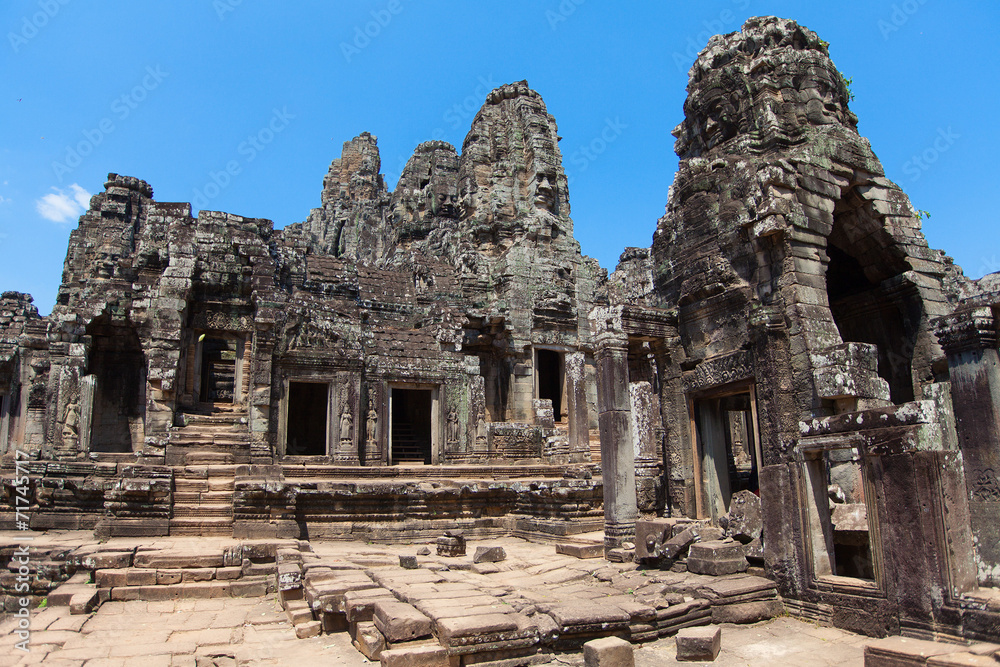The ancient ruins of a historic Khmer temple in the temple compl