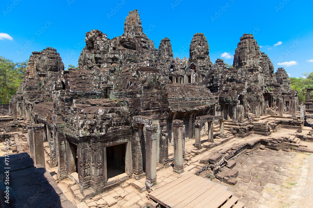The ancient ruins of a historic Khmer temple in the temple compl