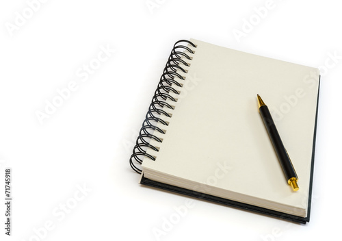 an isolated ringed blank notebook with a pen