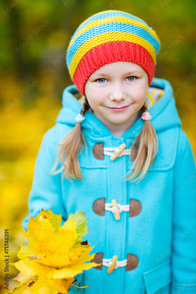 Little girl outdoors on autumn day Little girl outdoors on autumn day