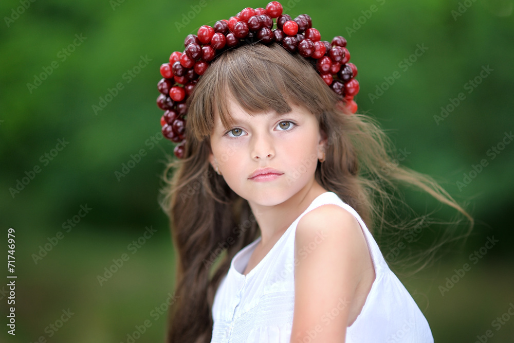 Naklejka premium portrait of little girl with a wreath of cherry