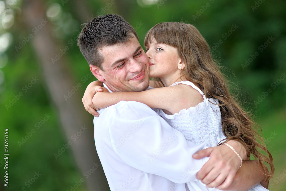 portrait of a happy family in summer nature