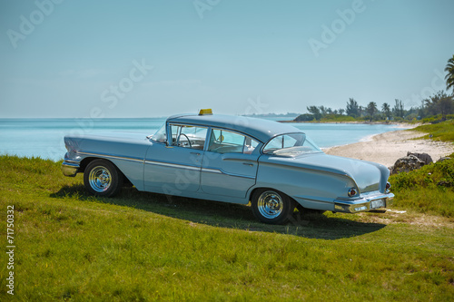Photography View of  vintage retro classic car parked at the beach
