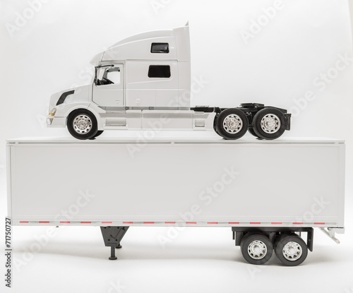 View of transport truck and trailer model on grey background photo