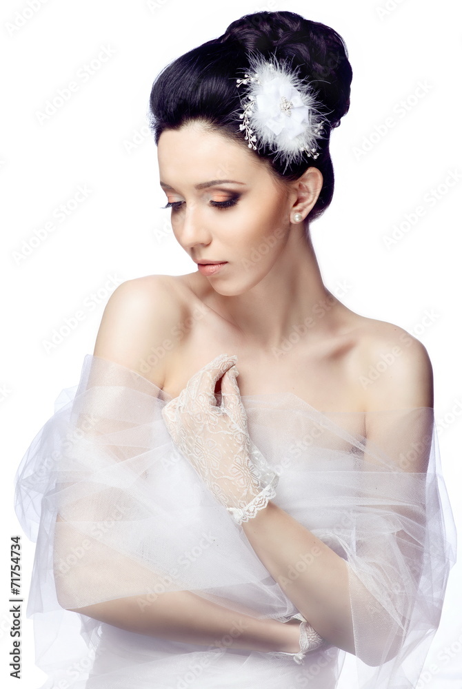 Modest young woman isolated on white studio background Modest young woman isolated on white studio background