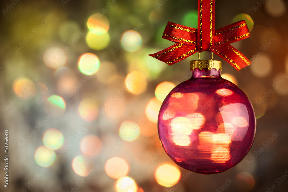 Fototapeta premium Christmas bauble over Beautiful magic bokeh background