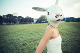 rabbit mask absurd beautiful young woman with white dress