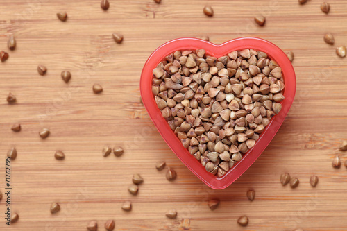Buckwheat in a heart bowl © rosinka79