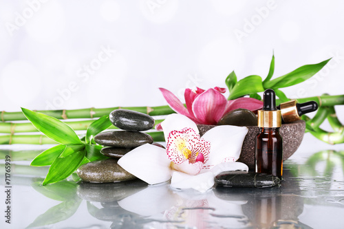 Spa stones, orchids, bamboo branches and aroma oil