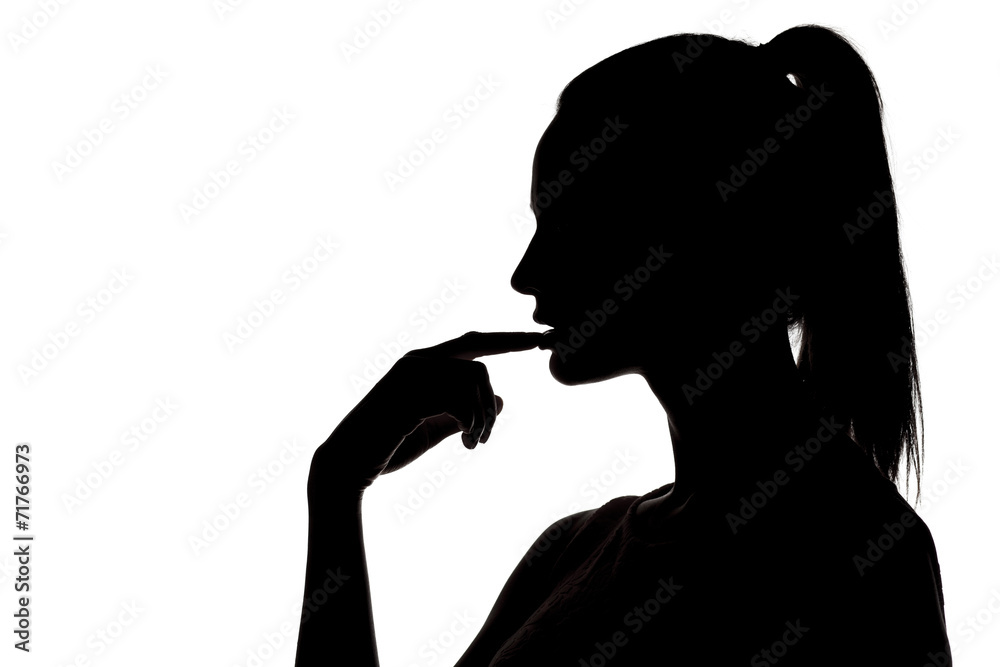 silhouette - sensual portrait of a woman touching her lips silhouette - sensual portrait of a woman touching her lips