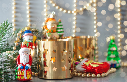 christmas toys with golden lanterns and defocused lights