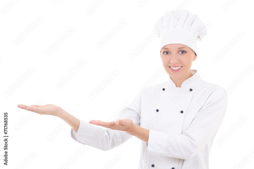 young woman chef showing or presenting something isolated on whi young woman chef showing or presenting something isolated on whi