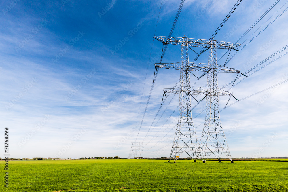 Power lines and pylons in a rural landscape