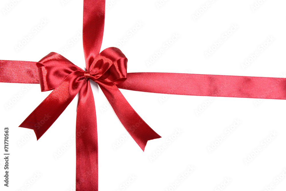 Shiny red ribbon with bow isolated on white Shiny red ribbon with bow isolated on white