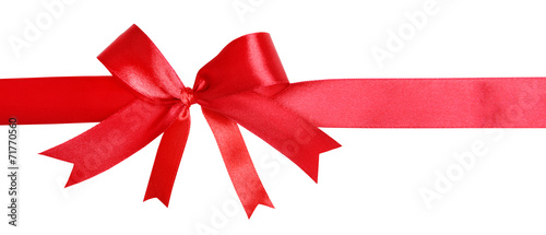 Shiny red ribbon with bow isolated on white