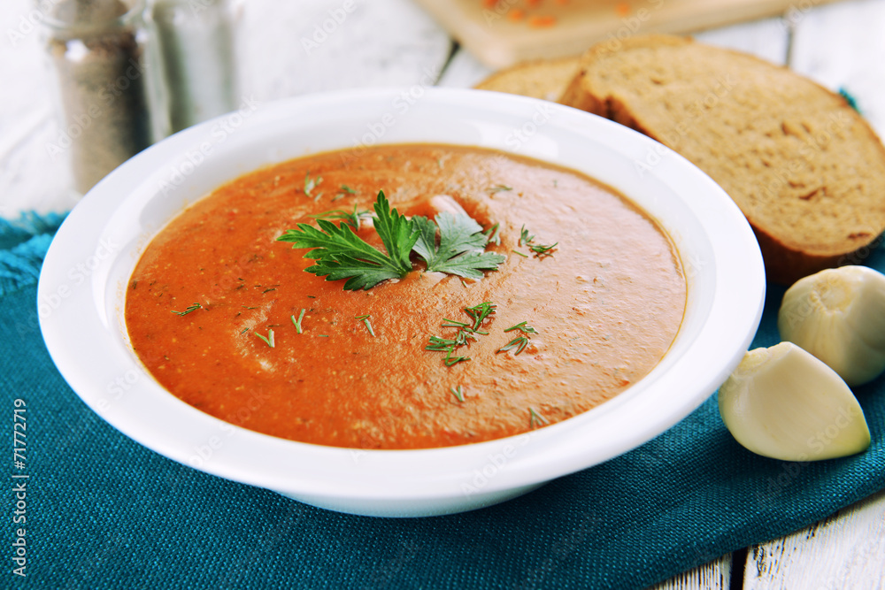 Delicious lentil cream-soup on table close-up Delicious lentil cream-soup on table close-up