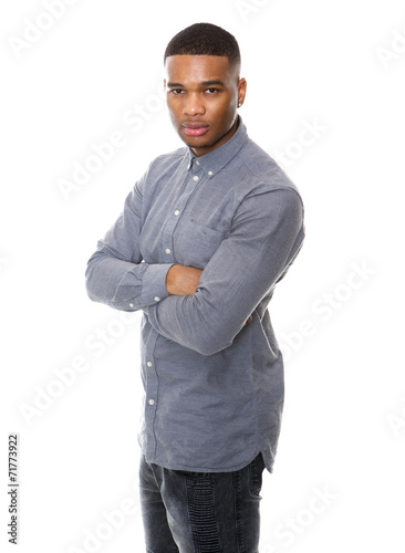Serious african american man posing with arms crossed © mimagephotos