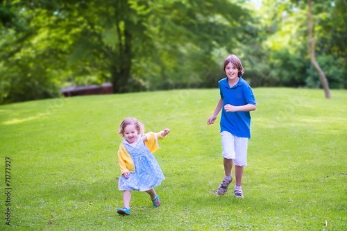 Happy kids running in a park