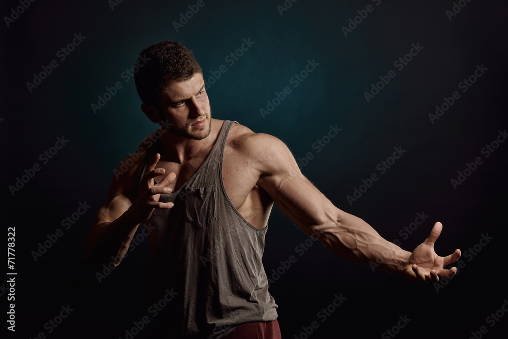 athletic young man portrait in studio