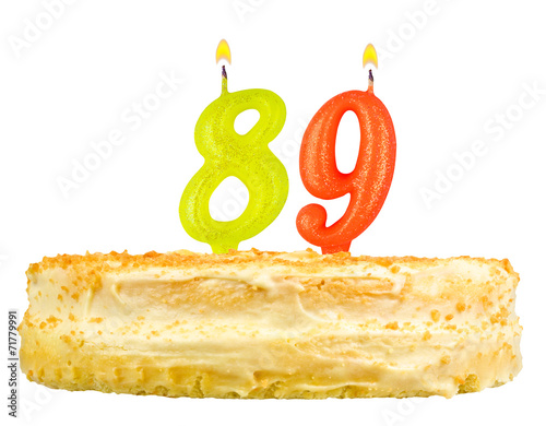 birthday cake with candles number eighty nine isolated on white photo