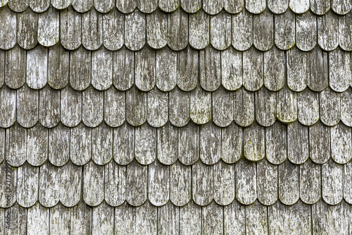 old wooden shingles on the roof photo