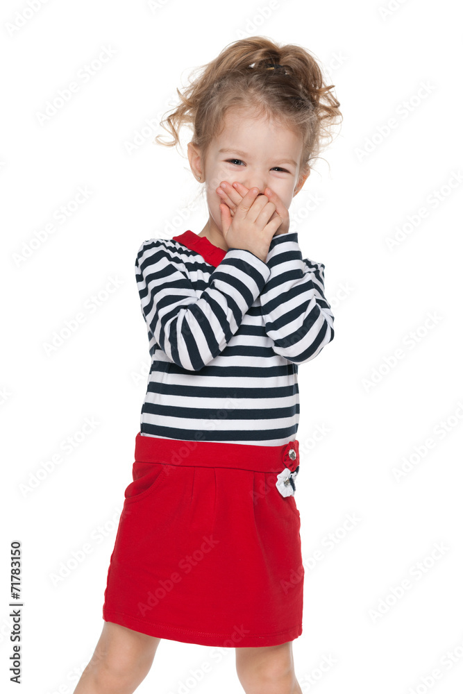 Little girl closes her mouth with her hands Little girl closes her mouth with her hands
