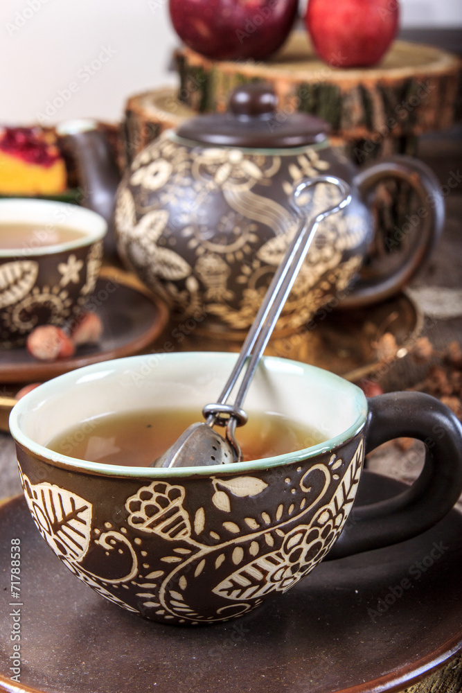Fototapeta premium Tea cup with strainer in vintage old house