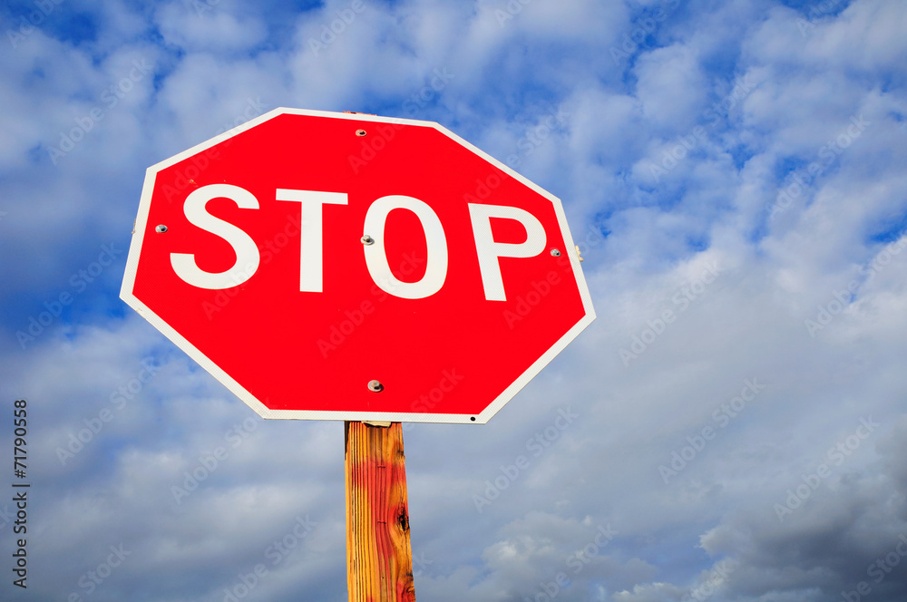 Prohibitory stop traffic sign under cloudy sky. Prohibitory stop traffic sign under cloudy sky.