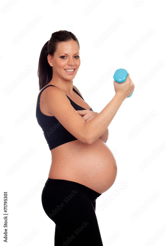 Brunette pregnant woman training with dumbbells Brunette pregnant woman training with dumbbells