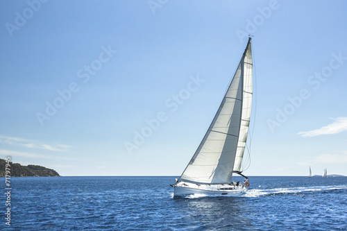 Boat in sailing regatta in open Sea.