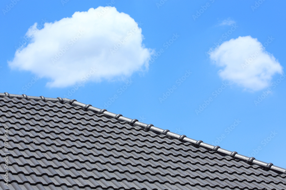 tile roof on a new house with blue sky tile roof on a new house with blue sky