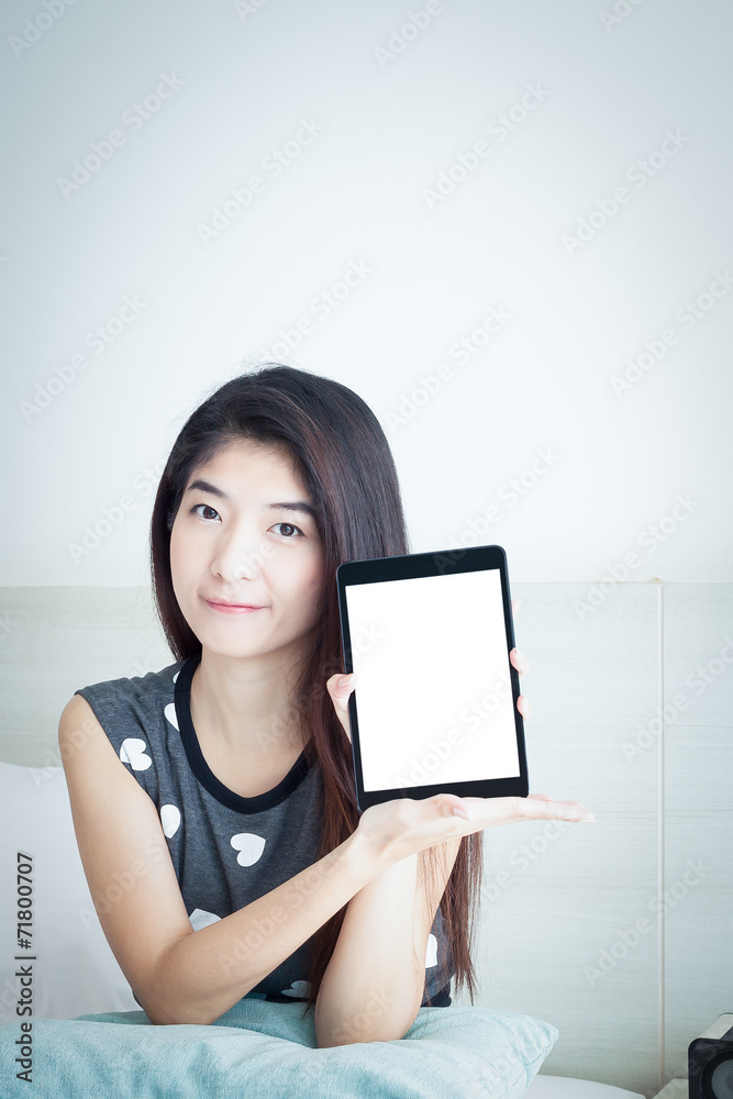 Young Asian woman show or display tablet with white blank screen Young Asian woman show or display tablet with white blank screen