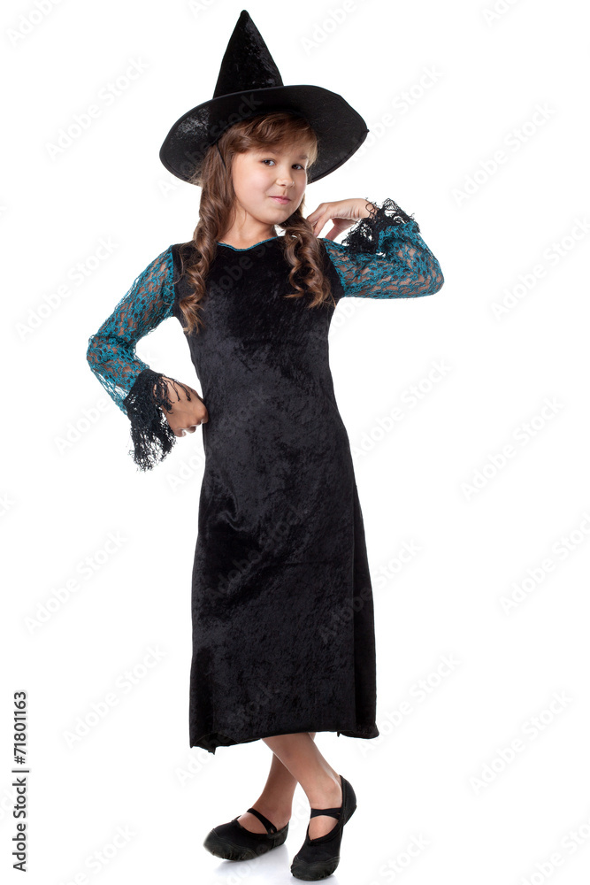Elegant little girl posing dressed as witch Elegant little girl posing dressed as witch