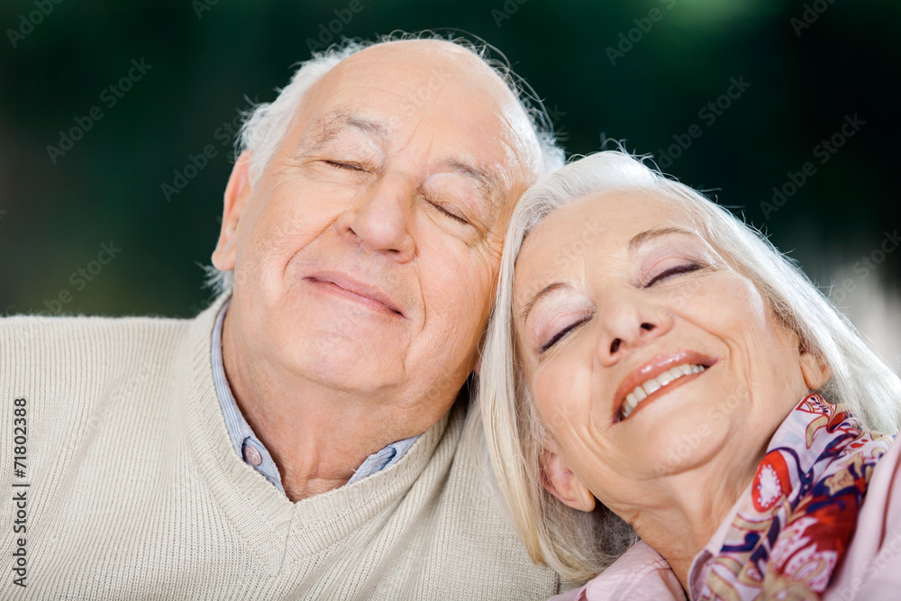 Loving Senior Couple Relaxing With Eyes Closed Loving Senior Couple Relaxing With Eyes Closed