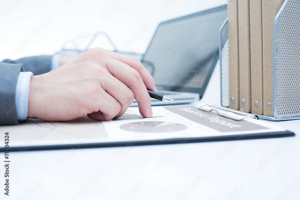 Businessman analyzing investment charts with laptop. Accounting
