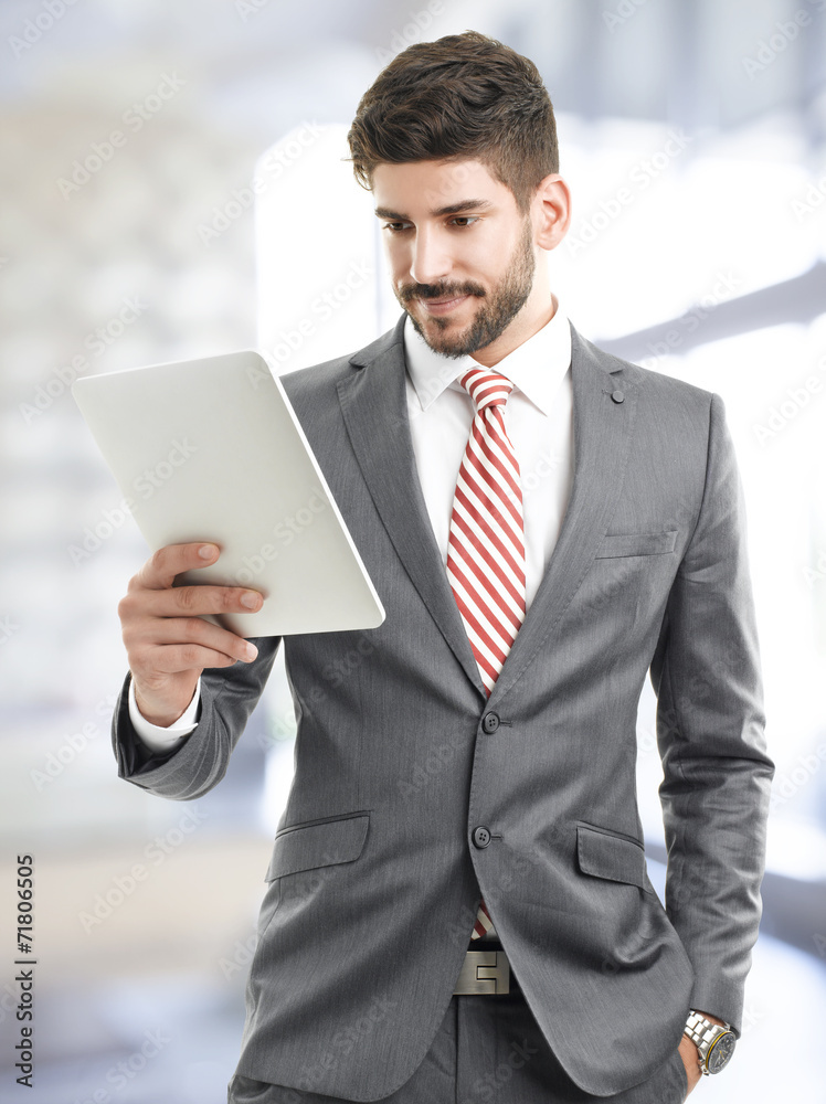 Portrait of young businessman portrait with digital tablet Portrait of young businessman portrait with digital tablet