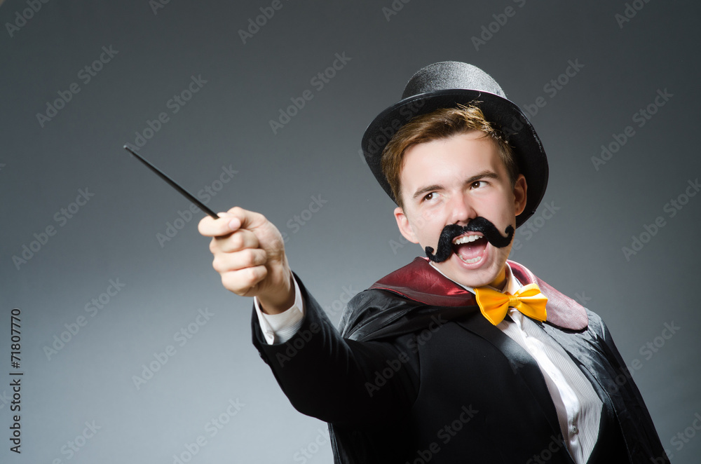 Funny magician with wand and hat Funny magician with wand and hat