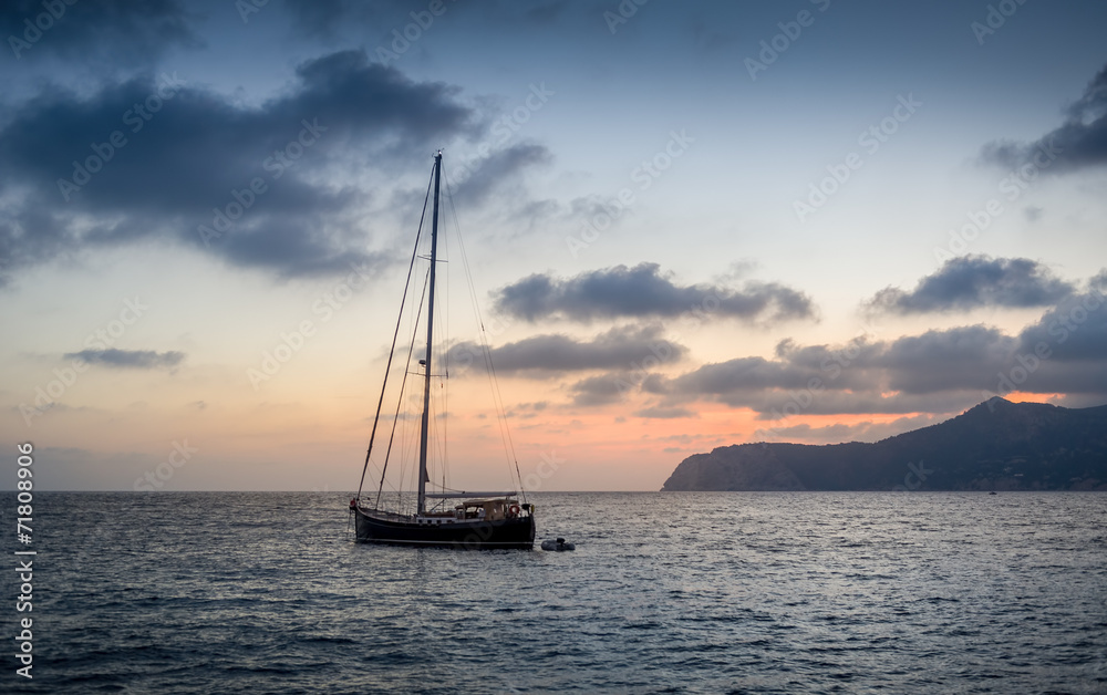 Sailing yacht at sunset