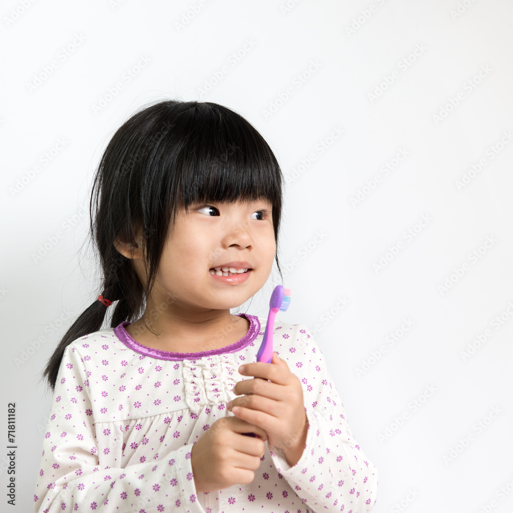 Child with toothbrush