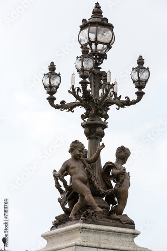 Street lantern on the Alexandre III Bridge in Paris, France. © wjarek