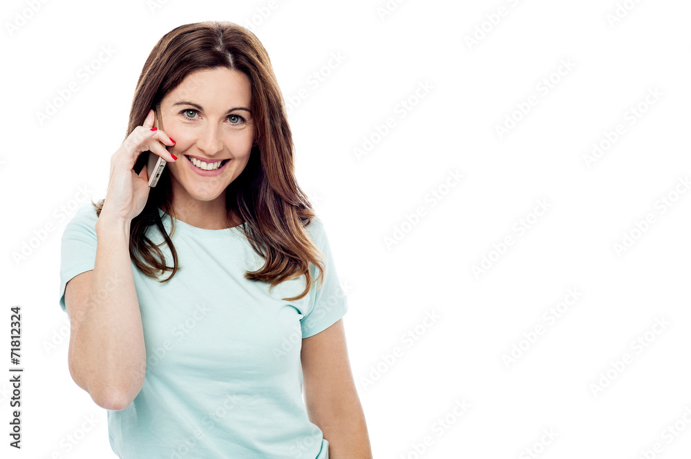 Smiling woman talking on her mobile Smiling woman talking on her mobile