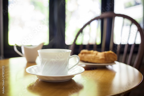 Wallpaper Mural Cup of coffee and bakery on table cafe interior Torontodigital.ca