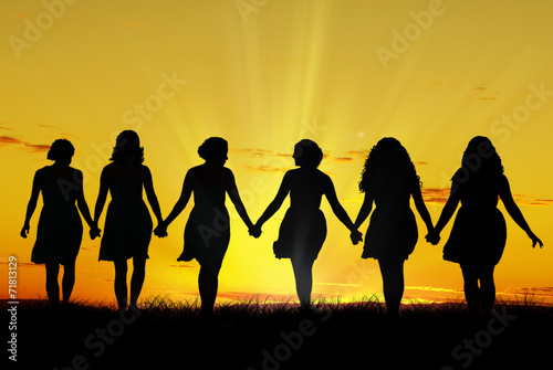 Women walking hand in hand