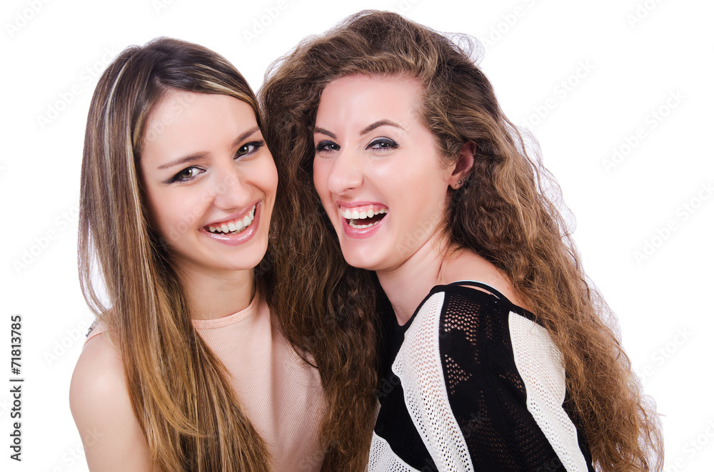 Two female friends isolated on the white Two female friends isolated on the white